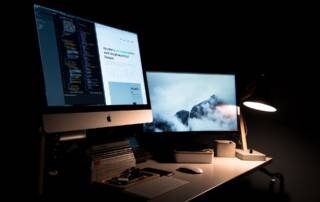 two monitors on a desk