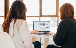 women looking at laptop